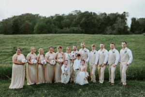 wedding party at ocoee river barn in rose gold and tan
