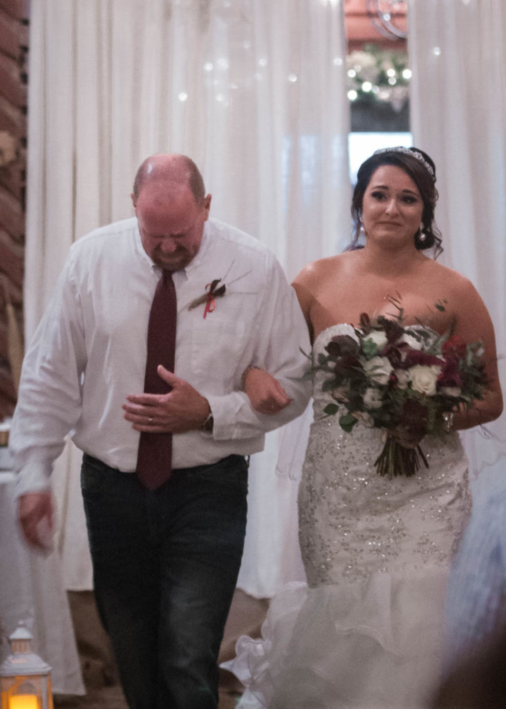 father walks bride down the aisle at rustic barn wedding tennessee